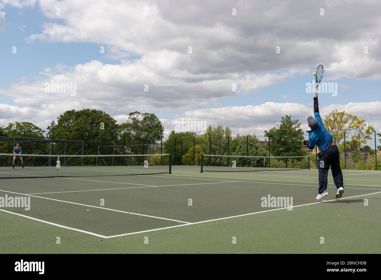 Brockwell Park, UK. 14th May 2020. People playing tennis in Brockwell Park  following Government advice that lockdown rules have been relaxed for a  small number of sports. Tennis, along with golf and