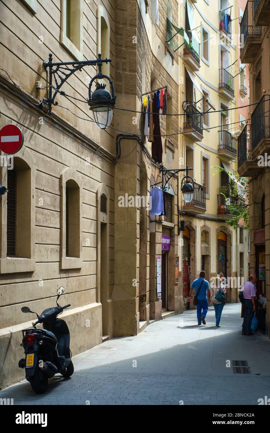 Typical side street in the historic part of Barcelona near la Rambla. Stock Photo