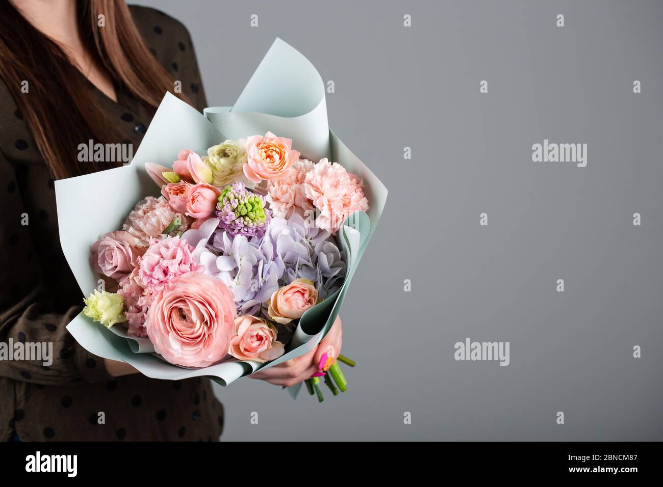 Beautiful bouquet of flowers. Roses, hydrangea, tulip, carnation. Stock Photo