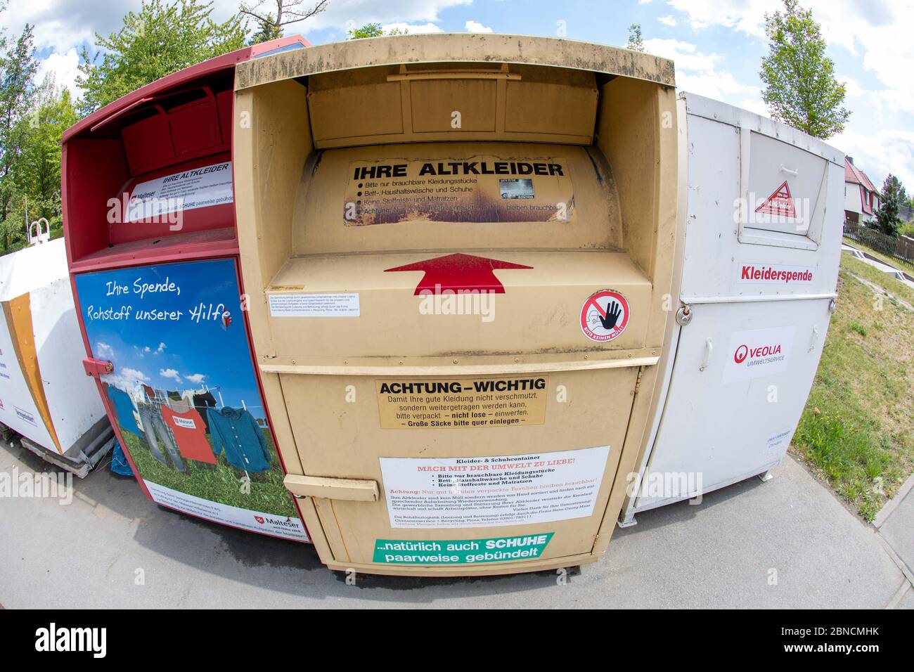 Pirna, Germany. 12th May, 2020. Three clothing containers (l-r) Malteser  Hilfsdienst, Hans-Georg-Maas Containerservice and Recycling Pirna and  Veolia Umweltservice stand side by side on Rudolf-Renner-Straße in Pirna,  Saxony. The clothes thrown in
