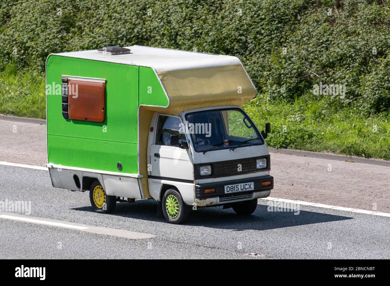 1986 80s green white 970cc hand painted Bedford Van; Cab over Touring Caravans and Motorhomes, campervans, RV leisure vehicle, family holidays, caravanette vacations, caravan holiday, veteran classic cars, cherished old timer, life on the road, Stock Photo