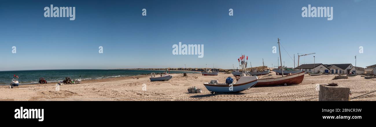 Coastal fishing boats on the beach at Klitmoeller Strand at the North Sea in Denmark Stock Photo