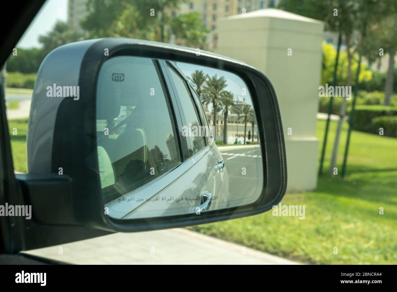 Doha, Qatar October13, 2019 Side mirror reflecting view of car