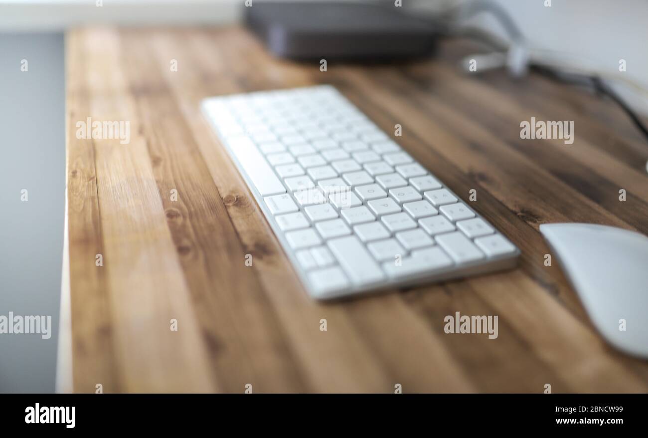 White keyword of a computer on the wooden table Stock Photo - Alamy