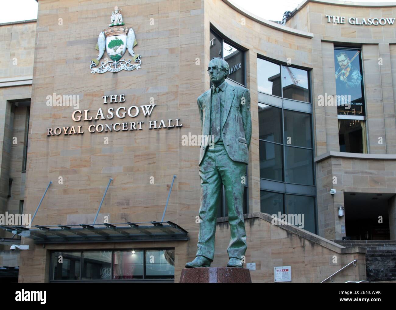 A statue of Donald Dewar, Scotland's first, first minister, stands in front of the Glasgow Royal Concert Hall at the top of Buchannan Street in Glasgow. Stock Photo