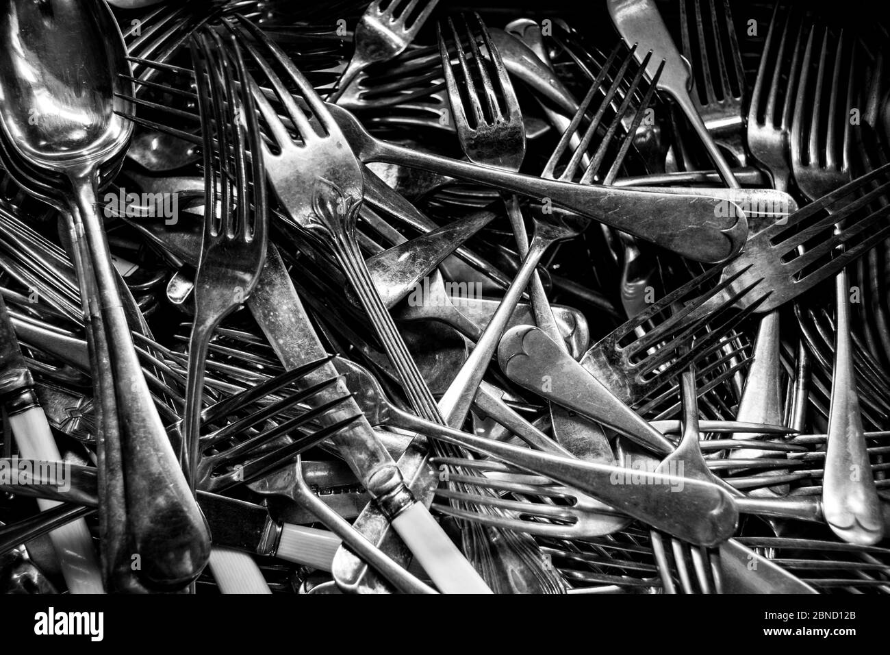 Drawer full of silver cutlery in black and white Stock Photo