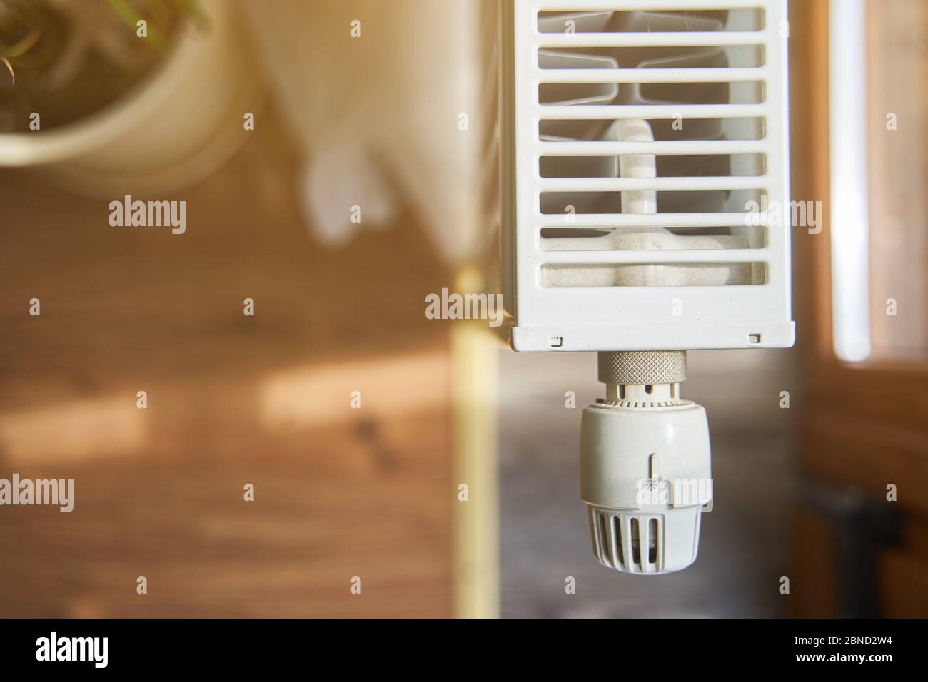Radiator in the apartment. White heated battery.  Stock Photo