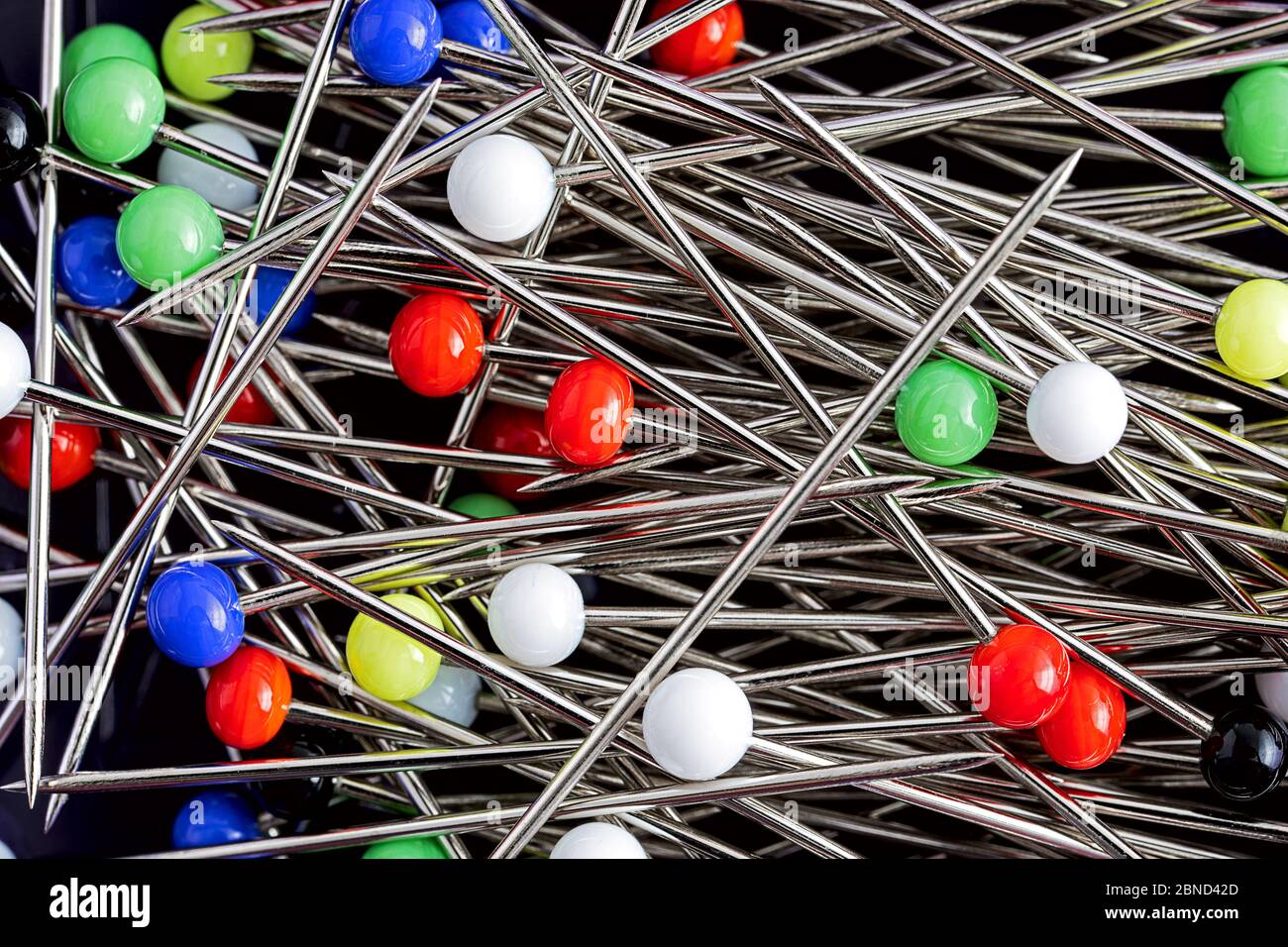 Image of Close Up View On Lots Of Sewing Pins With Colored Heads