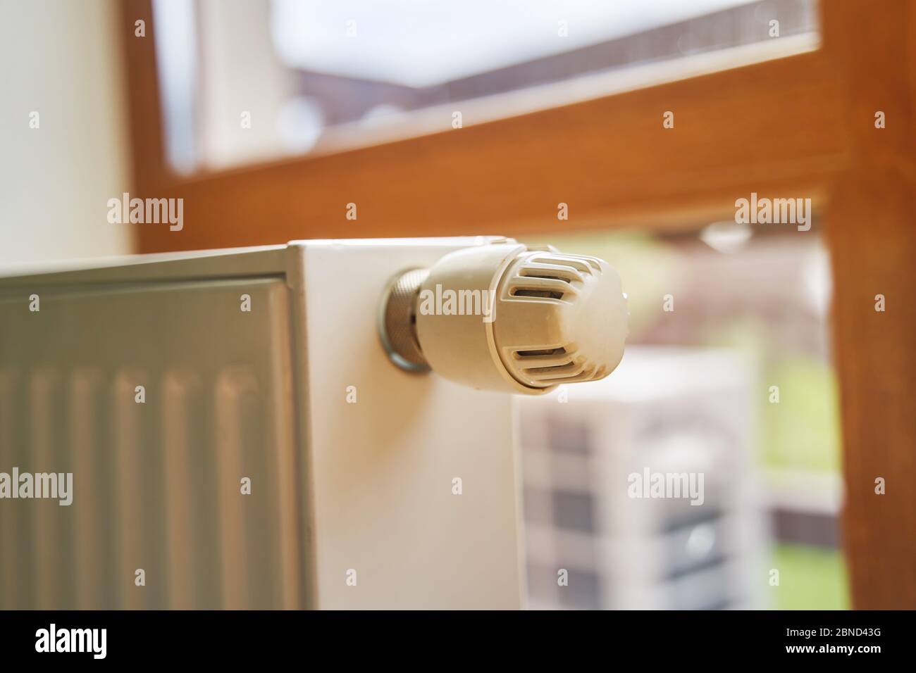 Radiator in the apartment. White heated battery.  Stock Photo