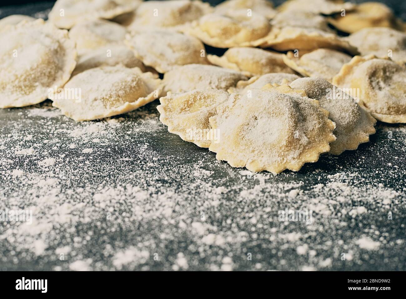 Tasty raw italian floured ravioli on wooden Stock Photo - Alamy