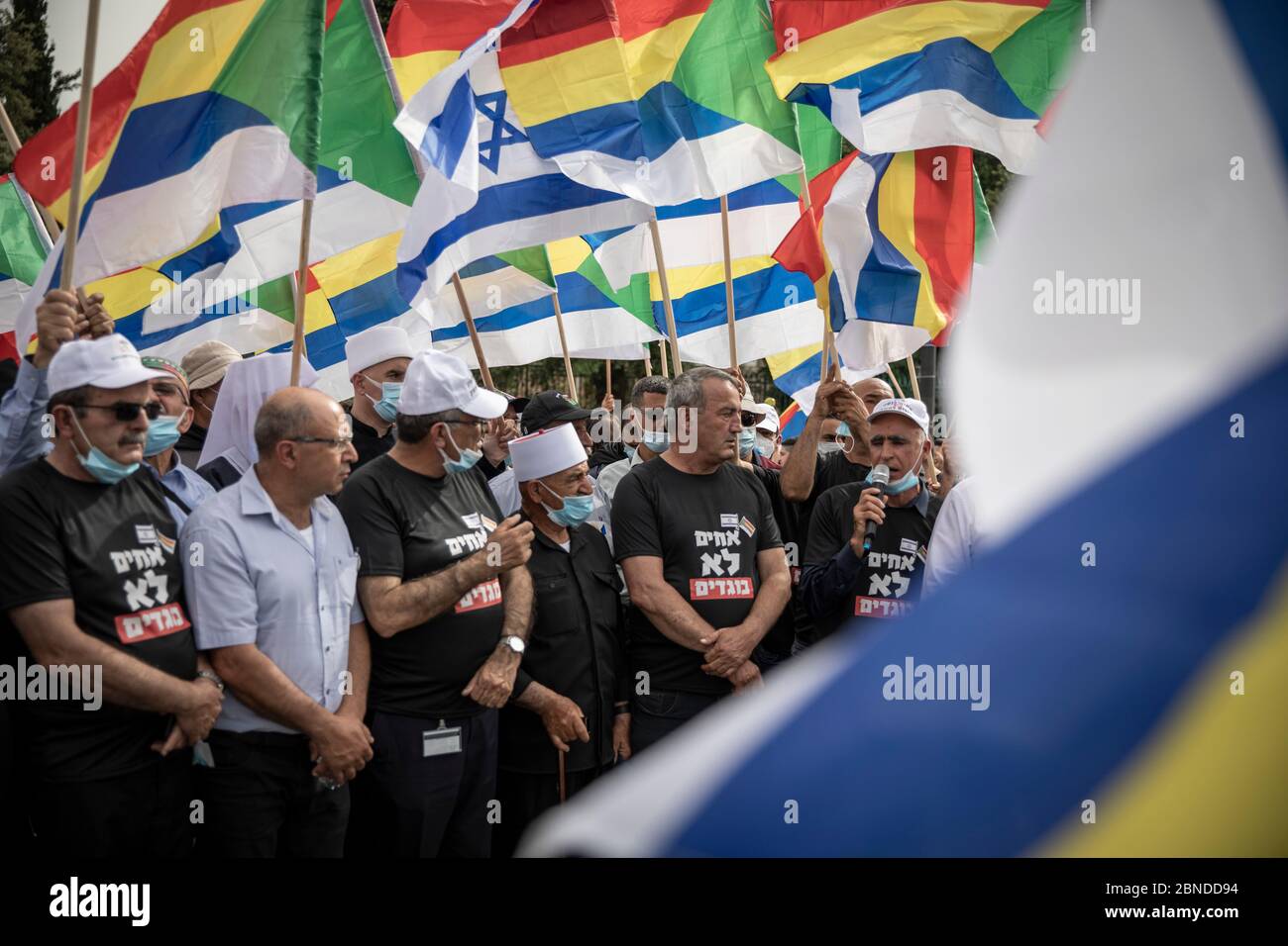 Jerusalem, Israel. 14th May, 2020. Participants wave flags as demonstrators  from different political groups protest against the forming of the new  Israeli government, led by leader of the Likud party Benjamin Netanyahu