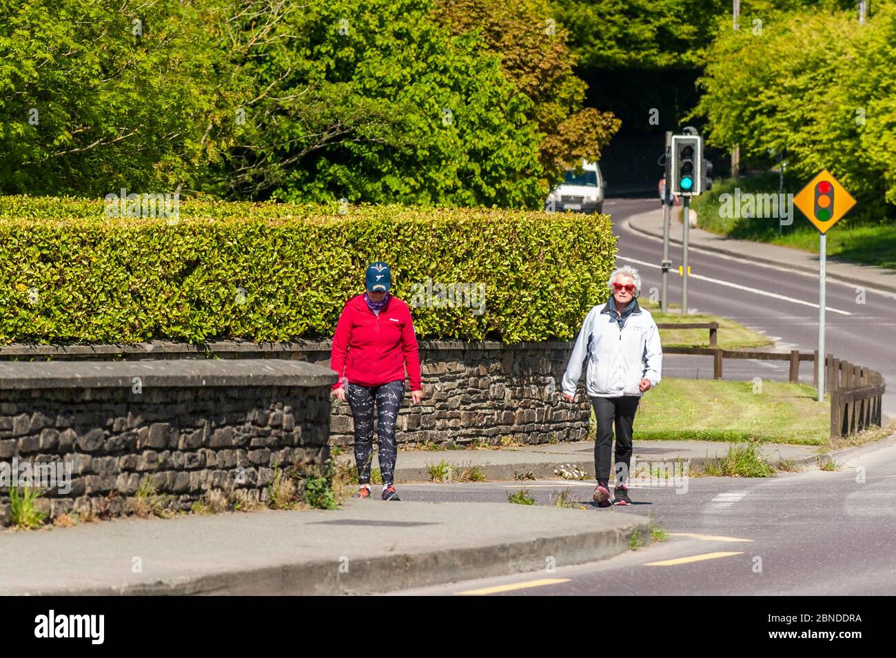 Clonakilty, West Cork, Ireland. 14th May, 2020. Two women walk in Clonakilty this afternoon, appearing to abide with social distancing guidelines set down by the government due to the Covid-19 pandemic. Credit: AG News/Alamy Live News Stock Photo