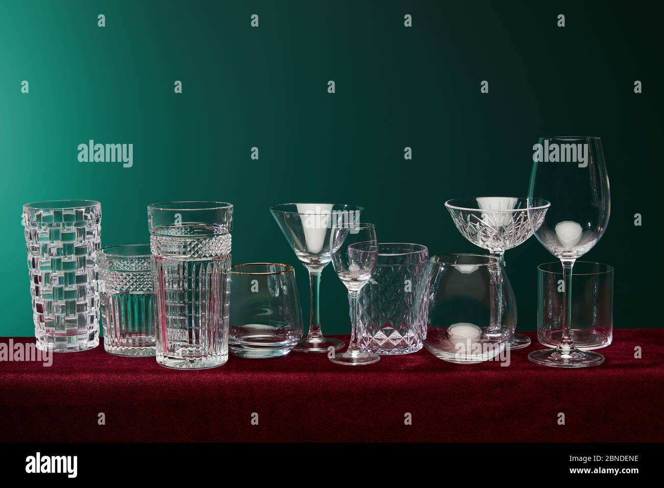 set of glasses: old fashioned glass, cocktail glass, champagne flute, shot glass, highball glass, collins glass, brandy glass, cognac balloon and coll Stock Photo