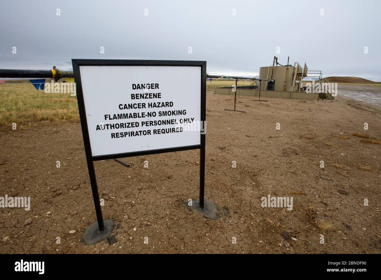Hazard sign in Jonah field, a coalbed methane extraction site, near Pinedale, Wyoming, USA. May 2012. Stock Photo