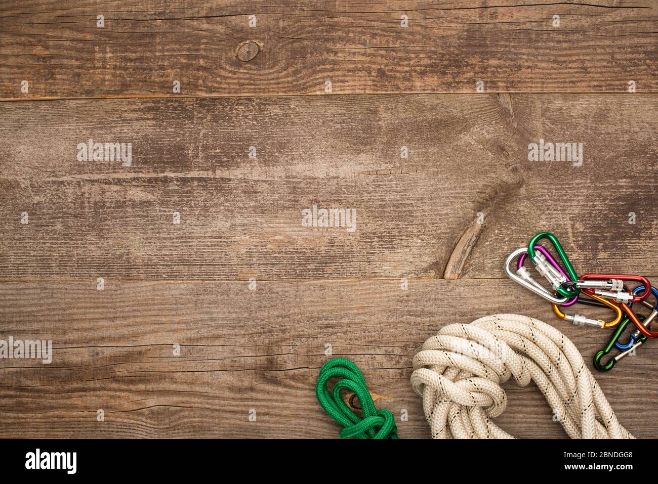 top view of hiking ropes and carabiners on wooden table Stock Photo - Alamy
