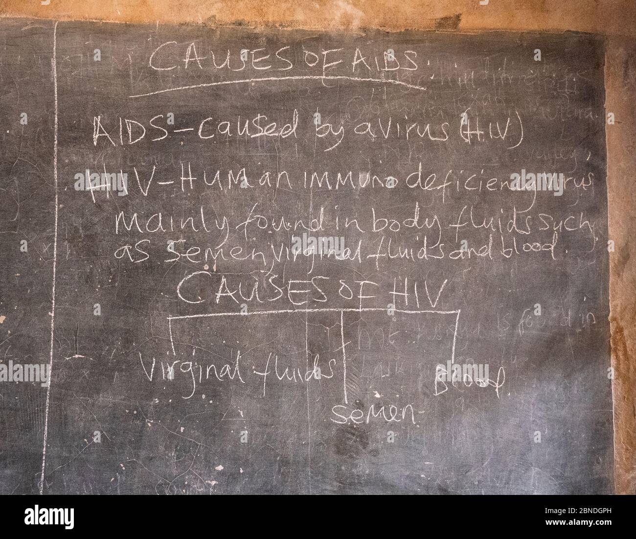 Chalk board in a school in Kenya with a lesson to teach students about HIV and AIDS Stock Photo