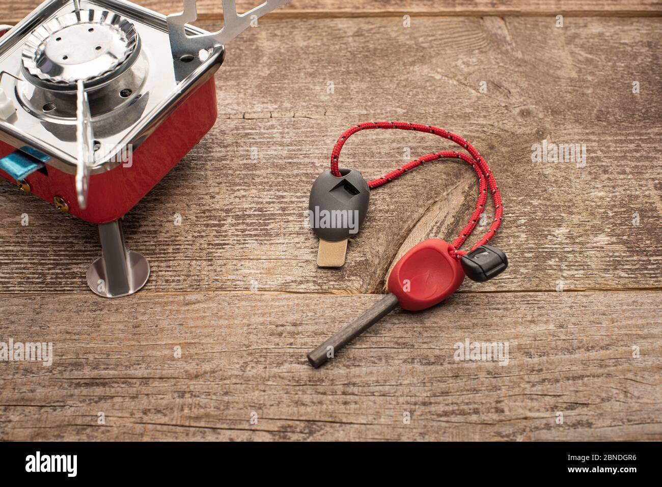 close up of gas-burner and spark lighter on wooden table Stock Photo - Alamy