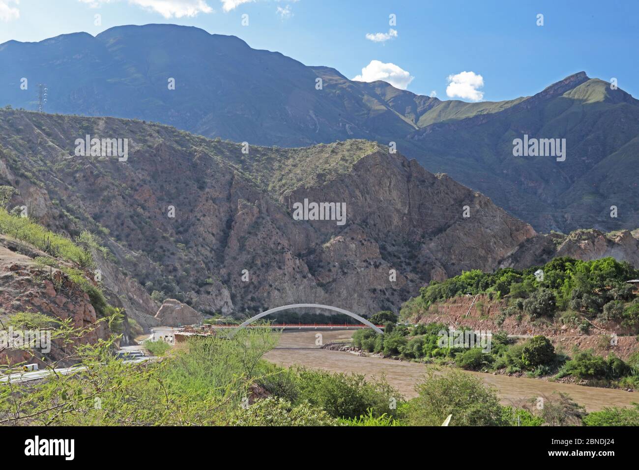 view of bridge over Maranon River to mountains beyond  Balsas, Peru                 March Stock Photo