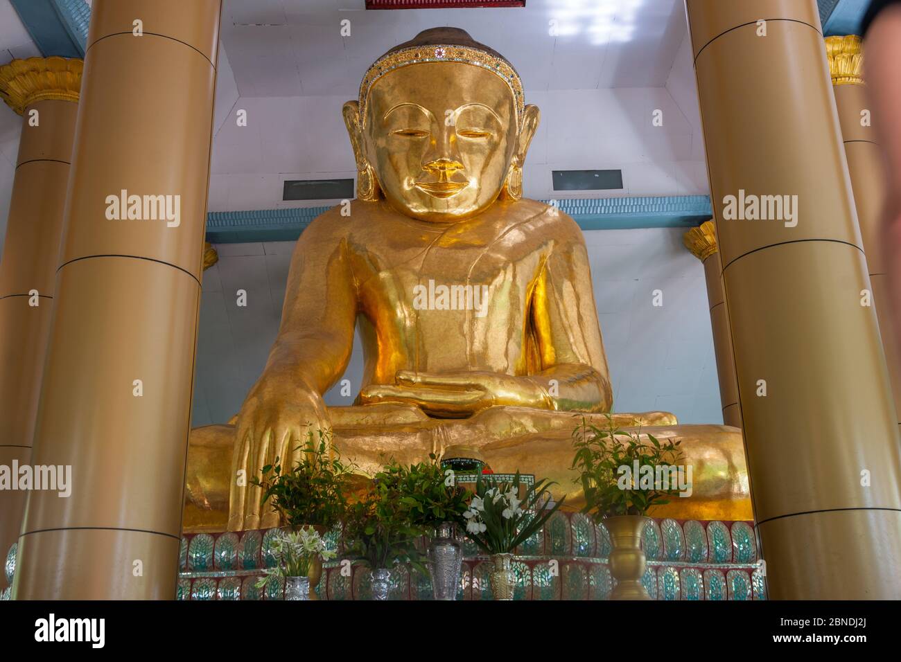 Sa Lay Myanmar - October 31 2013; Large golden Buddha statue in Yokesone Monastery historic wooden Buddhist monastery constructed in teak around 1882 Stock Photo