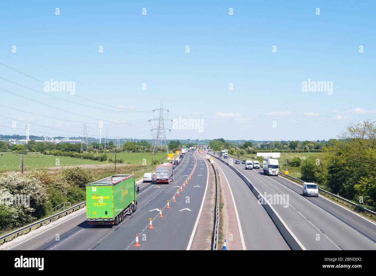 Roadworks on M56 motorway on sunny day blue sky near Frodsham 50mph average speed limit. England, UK Stock Photo
