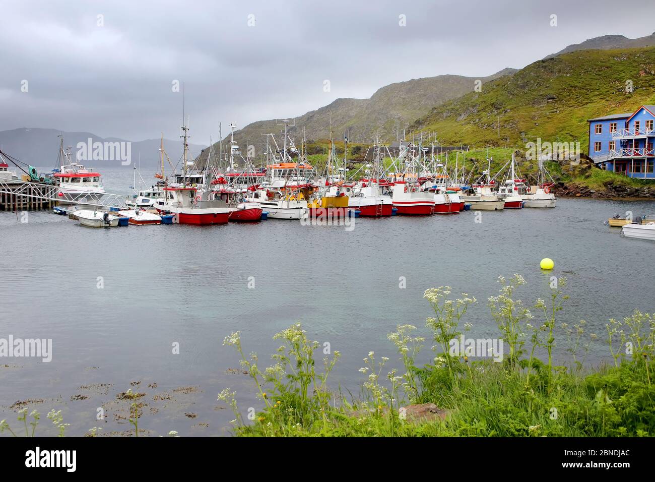 Beautiful fishing village of Kamoyvaer which lies along the Kamoyfjorden on the east side of the island of Mageroya, close to the town of Honningsvag. Stock Photo