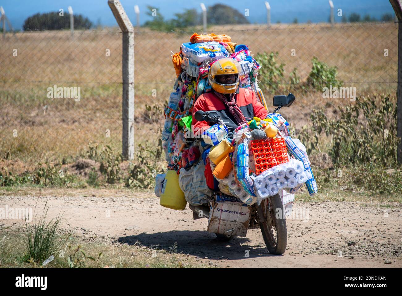 Motorcycle salesman for goods in Kenya Stock Photo