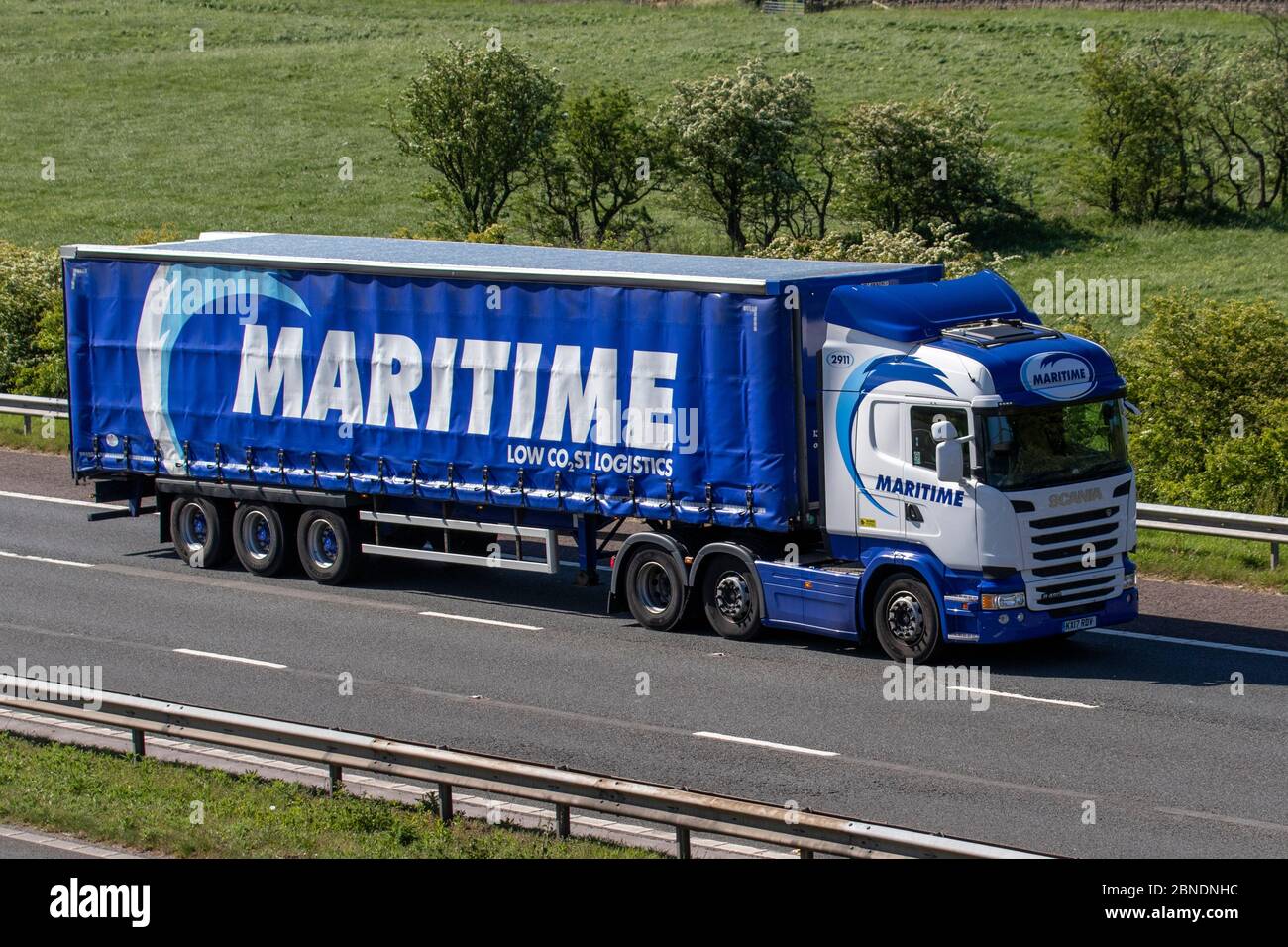 Maritime Haulage delivery trucks, articulated lorry, transportation, truck, cargo carrier, Scania vehicle, European commercial transport, industry, M61 at Manchester, UK Stock Photo