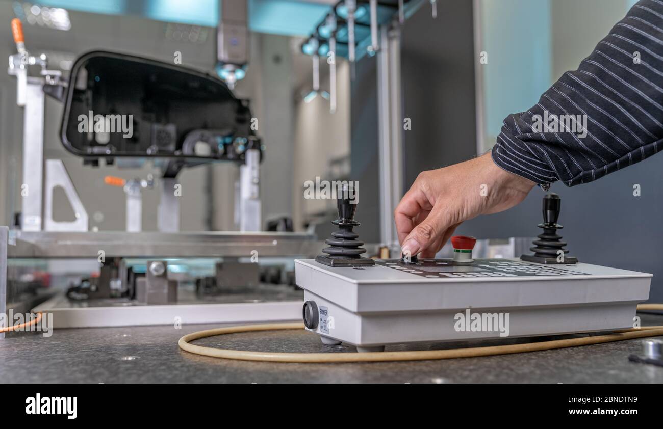 quality engineer controls an instrument for 3D measurement of plastic