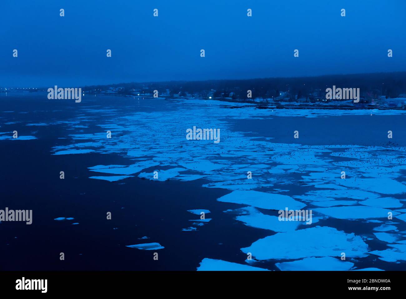 Sydney, Nova Scotia, sits at the Eastern tip of the Cape Breton island. During winter, ice floes float along the waterfront. Stock Photo