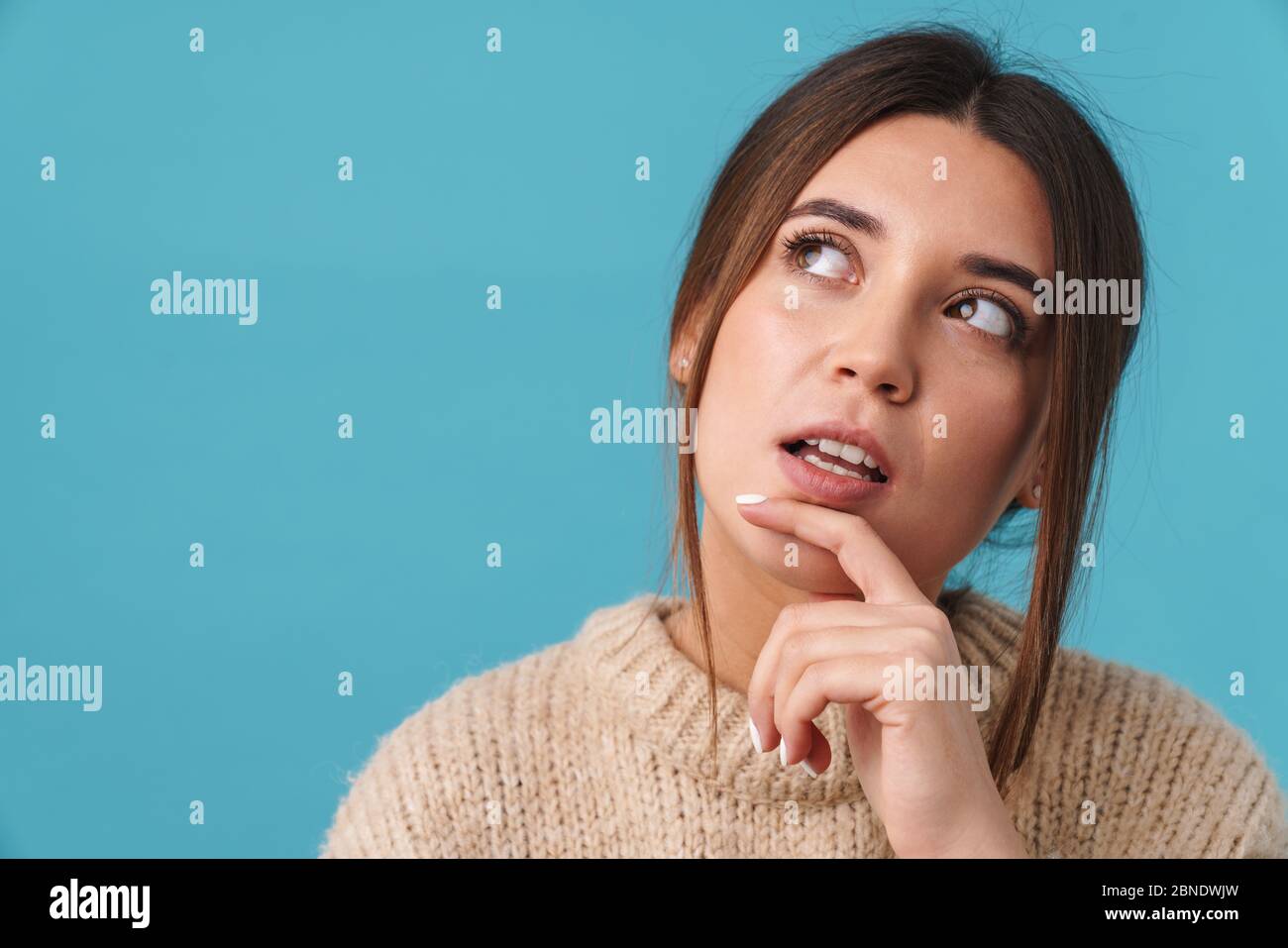 Image of serious caucasian woman thinking and looking upward isolated ...