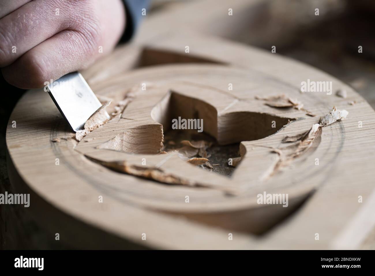 Close-up of the hand of a wood carver unrecognizable master at work. Stock Photo
