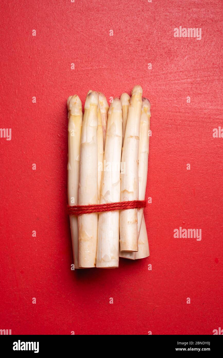 Bunch of white asparagus tied with a string. Above view with a bundle of white german white asparagus Stock Photo