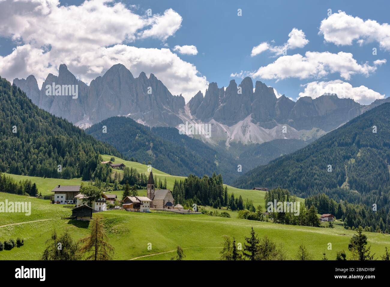 Val di Funes / Villnöß with the peaks of the Dolomites towering above in the summer Stock Photo