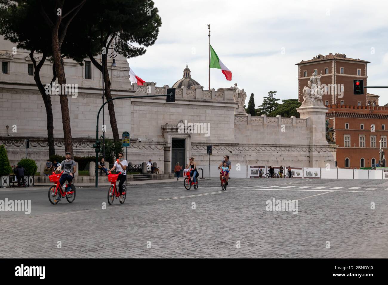 Rome, Italy - May 10, 2020: Viale dei Fori Imperiali, first exit of citizens after the end of the restrictions for the Covid-19 pandemic. People strol Stock Photo