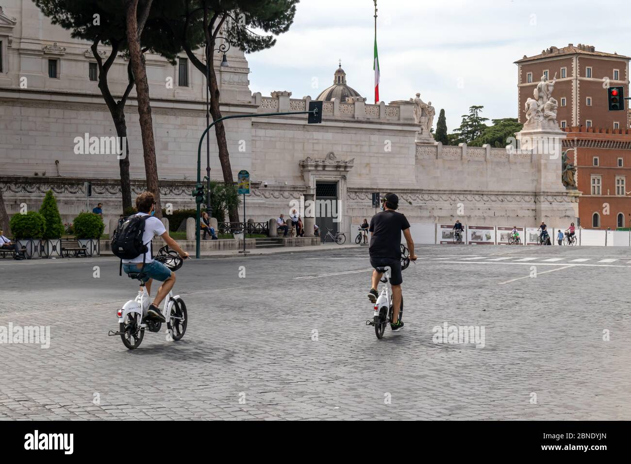 Rome, Italy - May 10, 2020: Viale dei Fori Imperiali, first exit of citizens after the end of the restrictions for the Covid-19 pandemic. People strol Stock Photo