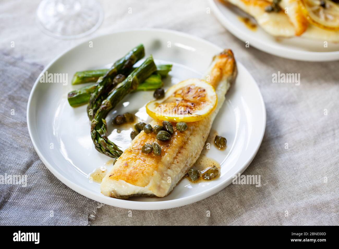 Lemon sole with butter and capers sauce and asparagus Stock Photo Alamy