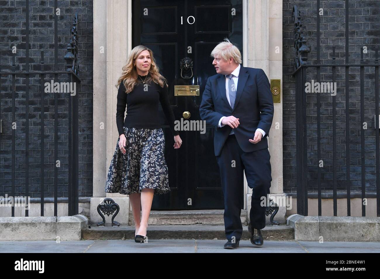 Prime Minister Boris Johnson And His Partner Carrie Symonds Stand In Downing Street London To Join In The Applause To Salute Local Heroes During Thursday S Nationwide Clap For Carers To Recognise And