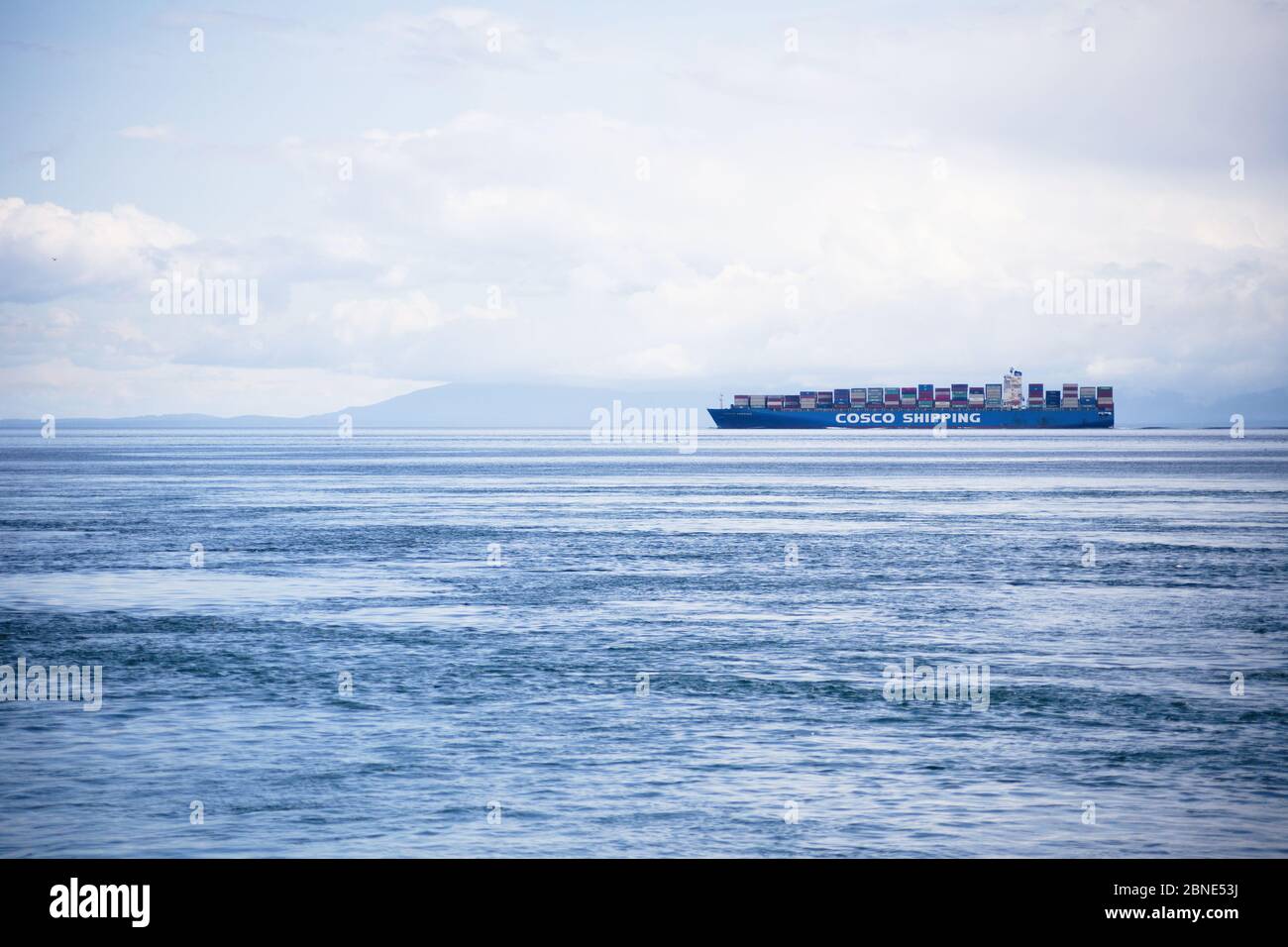 Cosco Cargo Ship, Juan de Fuca Strait, near Victoria BC Canada. Stock Photo
