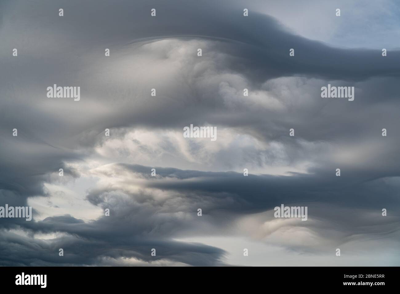 Interesting unusual lenticular clouds. Dramatic sky Stock Photo