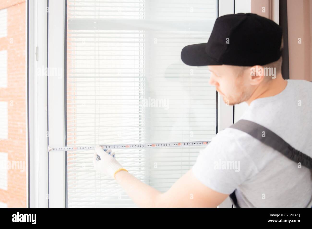 Master worker measures upvc window with ruler, installation process ...