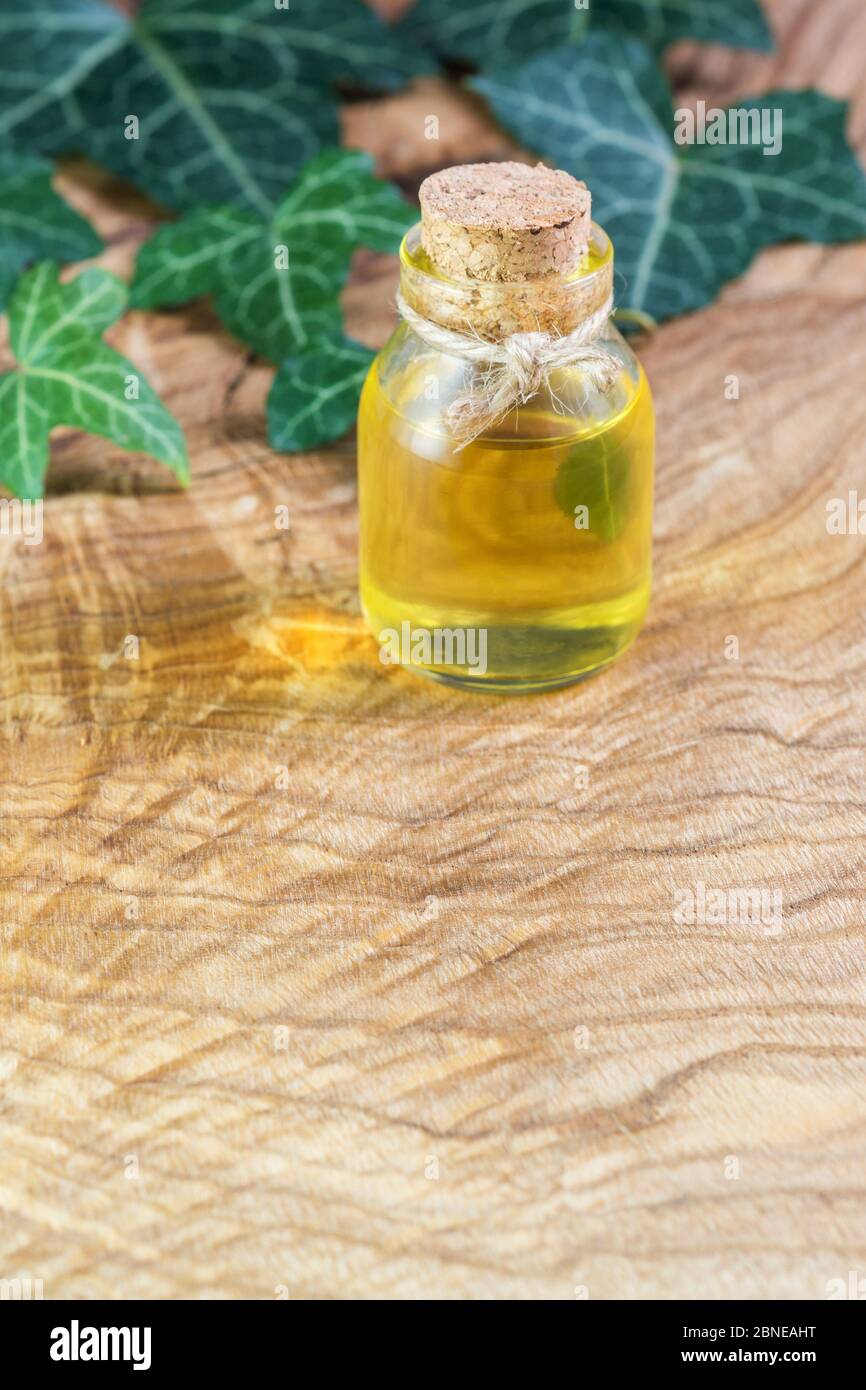 A bottle of vegetable oil on a beautiful textured wooden table. Omega3