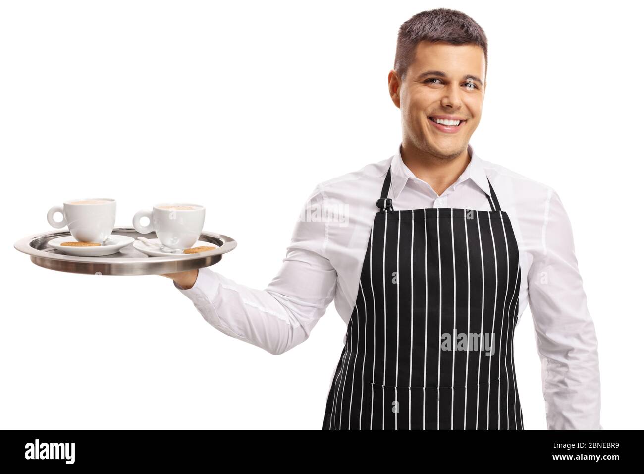 Young male waiter with cups on a tray isolated on white background Stock Photo