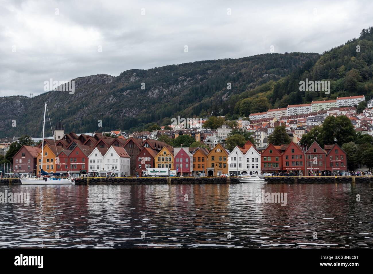 Bergen, Norway - September 09, 2019: Sea water view on historical buildings in Hanseviertel Bryggen wharf in Bergen, Norway. UNESCO World Heritage Sit Stock Photo