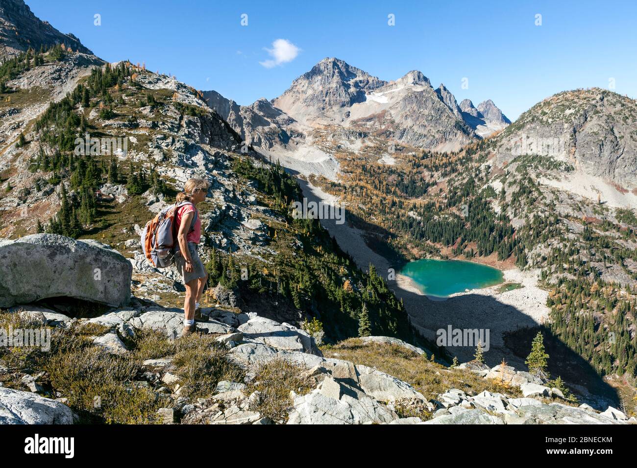 Vicky Spring hiking near Horsefly Pass above Lewis Lake, North Cascade National Park Complex, Washington, USA. October 2015. Model Released. Stock Photo