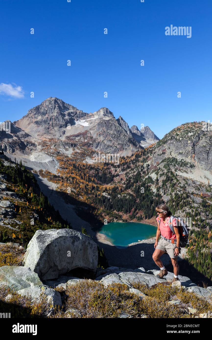 Vicky Spring hiking near Horsefly Pass above Lewis Lake, North Cascade National Park Complex, Washington, USA, October 2015. Model Released. Stock Photo