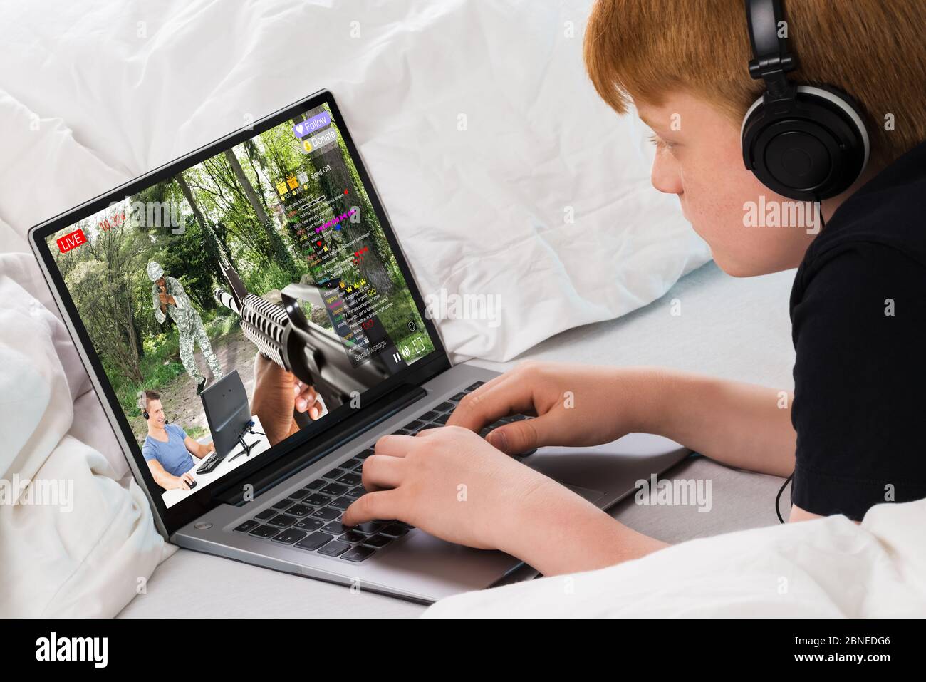Kid Watching Live Game Streaming Session On Laptop Computer Stock Photo