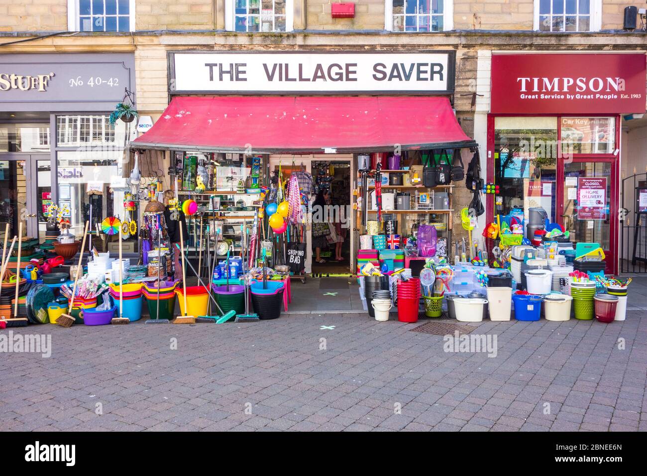 Traditional hardware shop store with colourful buckets and brushes