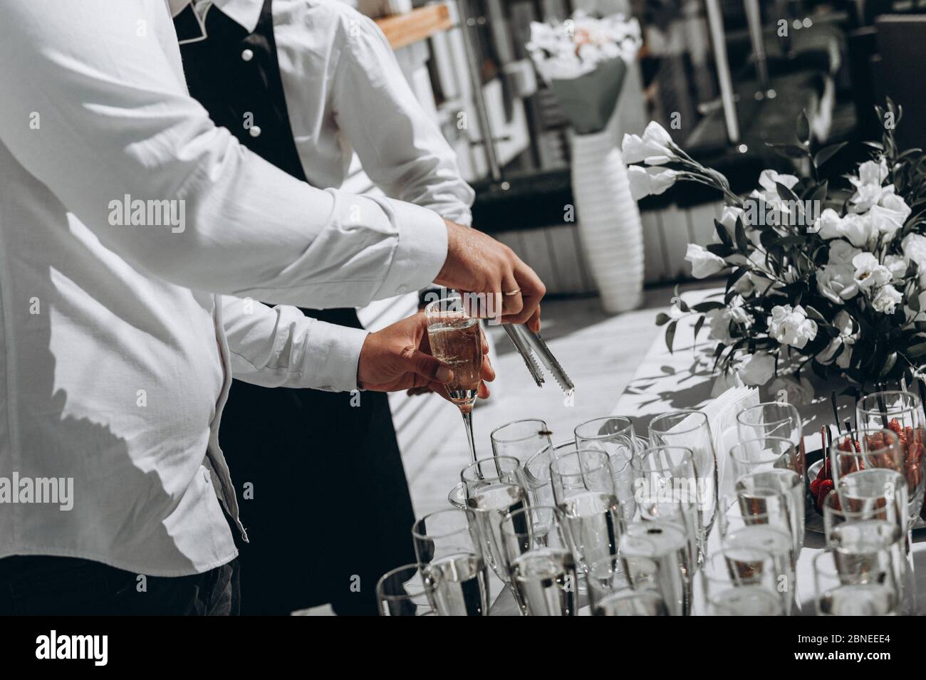 bartender hands bartender makes cocktail at party. On the party Stock Photo