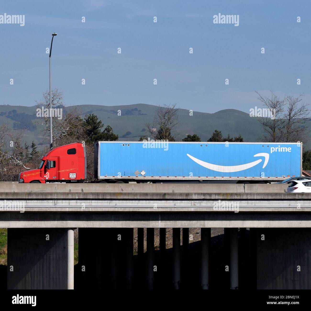Amazon Prime truck on 880 overpass over Alameda Creek, California, Stock Photo