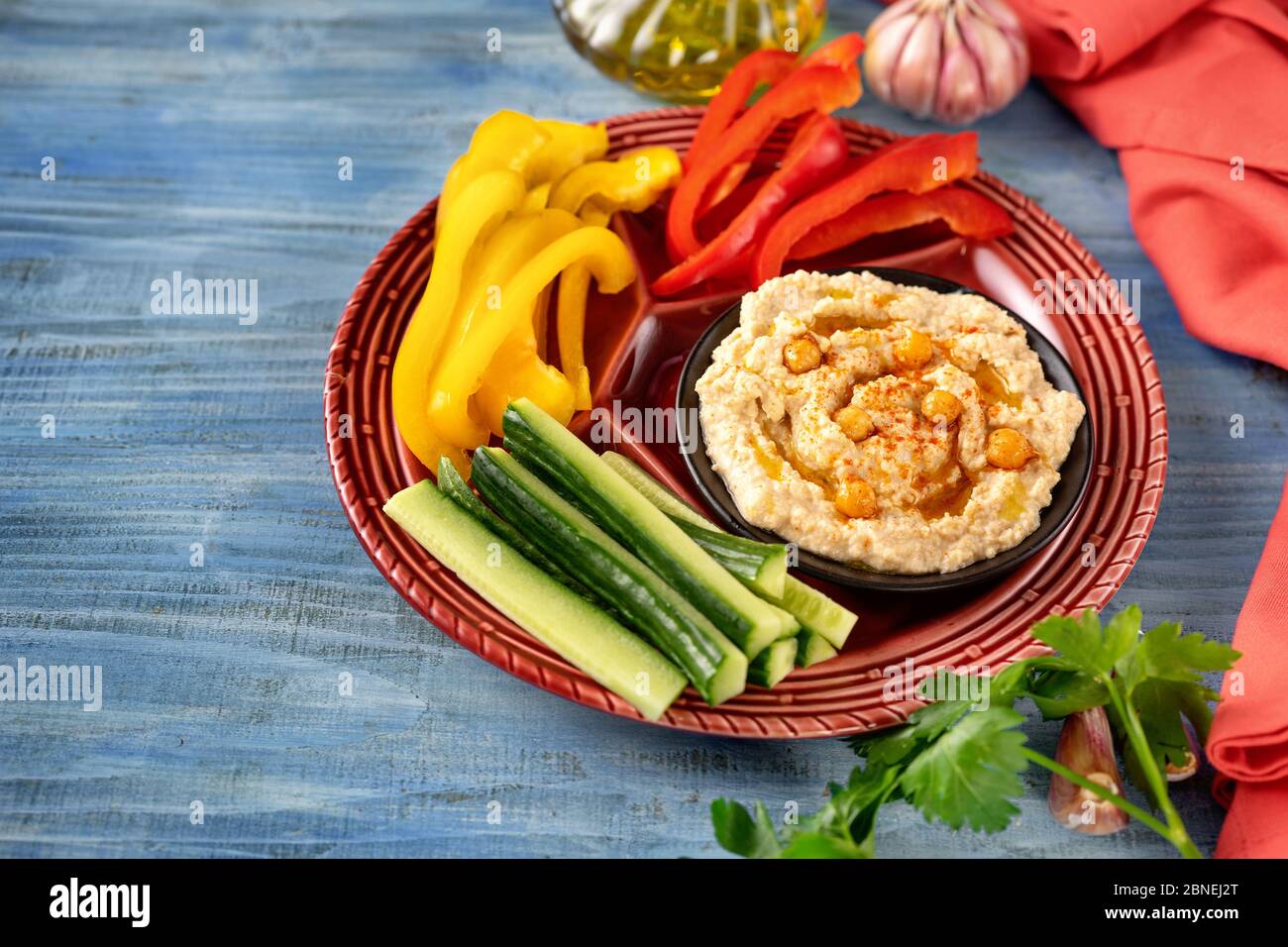 Bright platter of assorted fresh vegetables with hummus dip Stock Photo Alamy